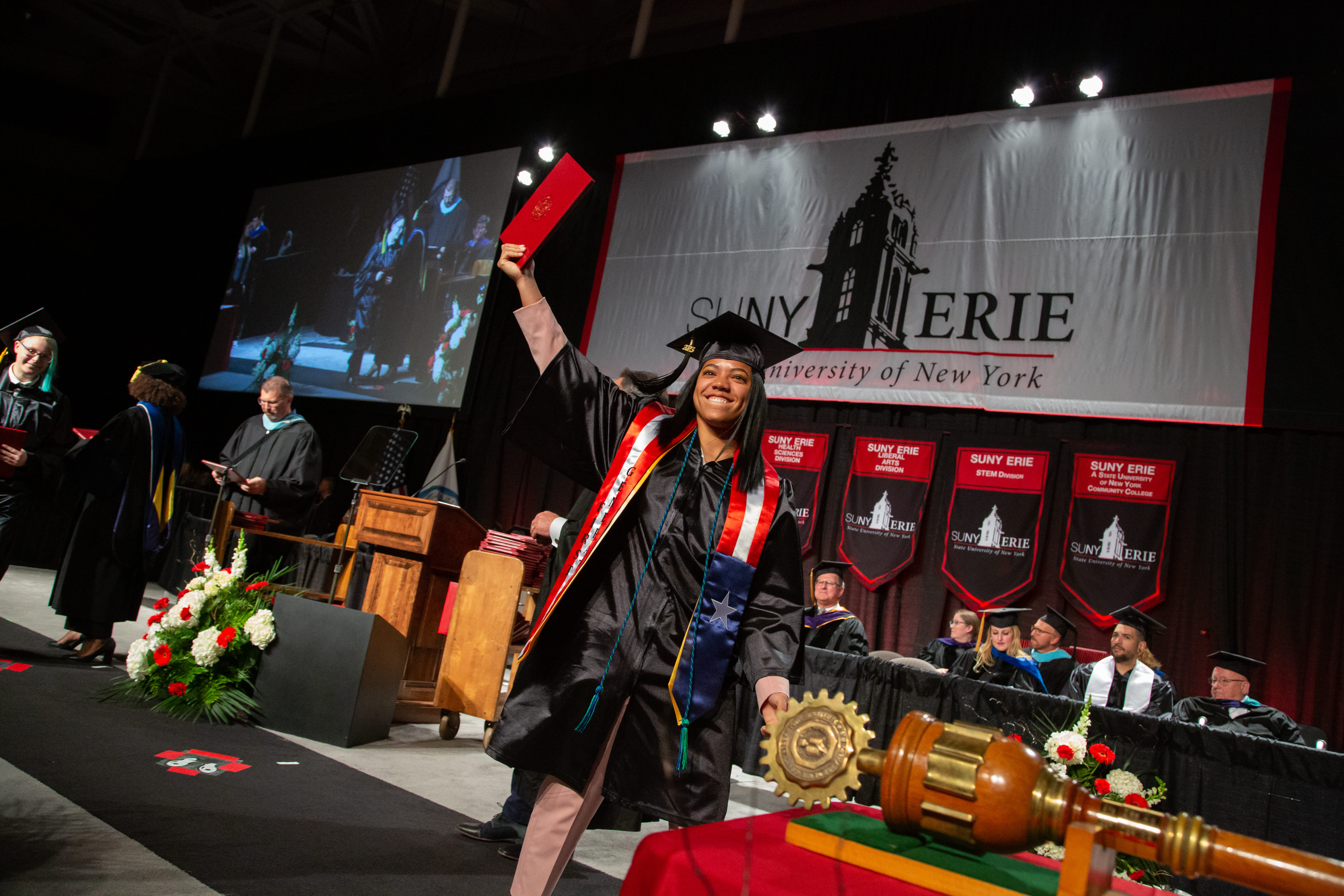 Student Crossing Stage at Commencement