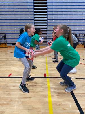 Girls Learning Volleyball