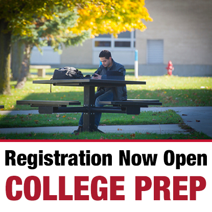 SUNY Erie College Prep Programs Student sitting at table outside on campus.