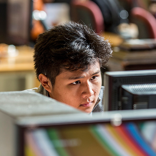 Man using a computer to complete forms