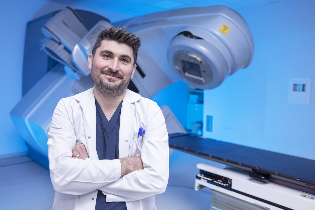 In a modern oncology clinic, a man is prepared for radiation therapy on a modern linear accelerator. Modern approaches to the treatment of oncology.